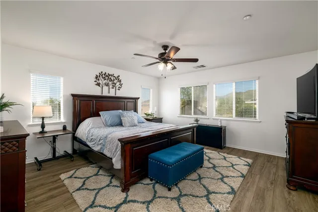 a bed room with a bed and a television