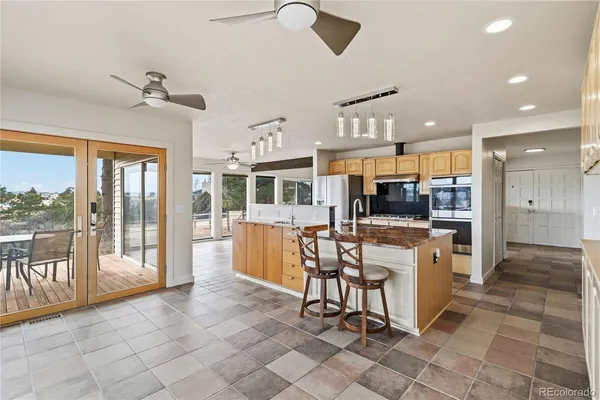 a view of a dining area with furniture window and outside view