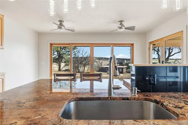 a view of a living room and kitchen