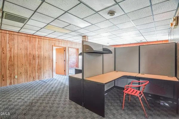 a room with furniture and air hockey table