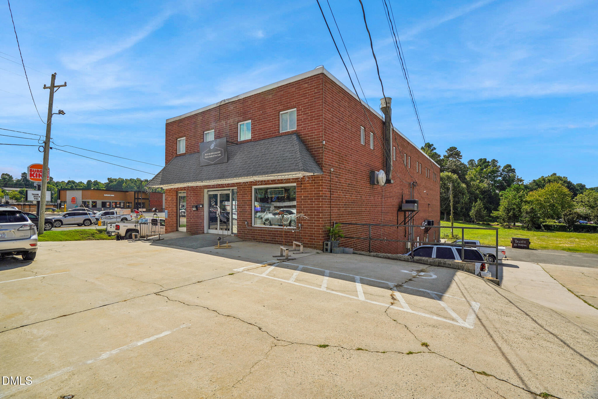 225 South Madison Boulevard Roxboro, NC 27573 - Photo 7 of 19 a patio with a table and chairs under an umbrella