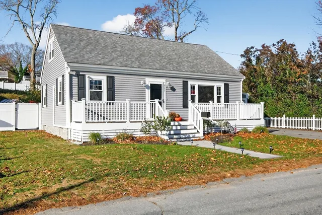 a view of a house with wooden deck