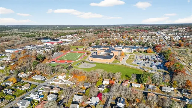 an aerial view of residential houses with outdoor space