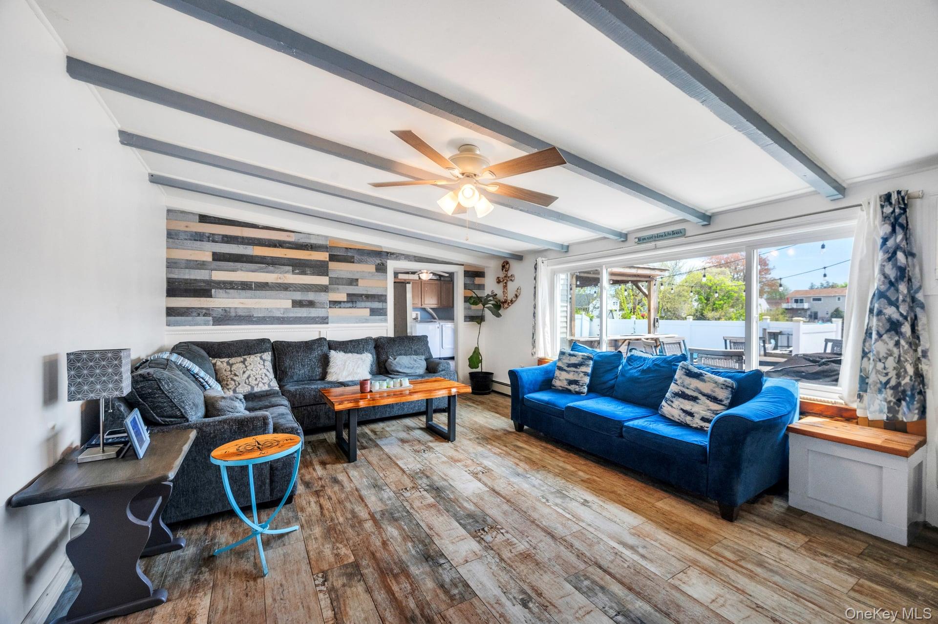 24 Raynor Street West Babylon, NY 11704 - Photo 16 of 45 Living room featuring hardwood / wood-style floors and ceiling fan
