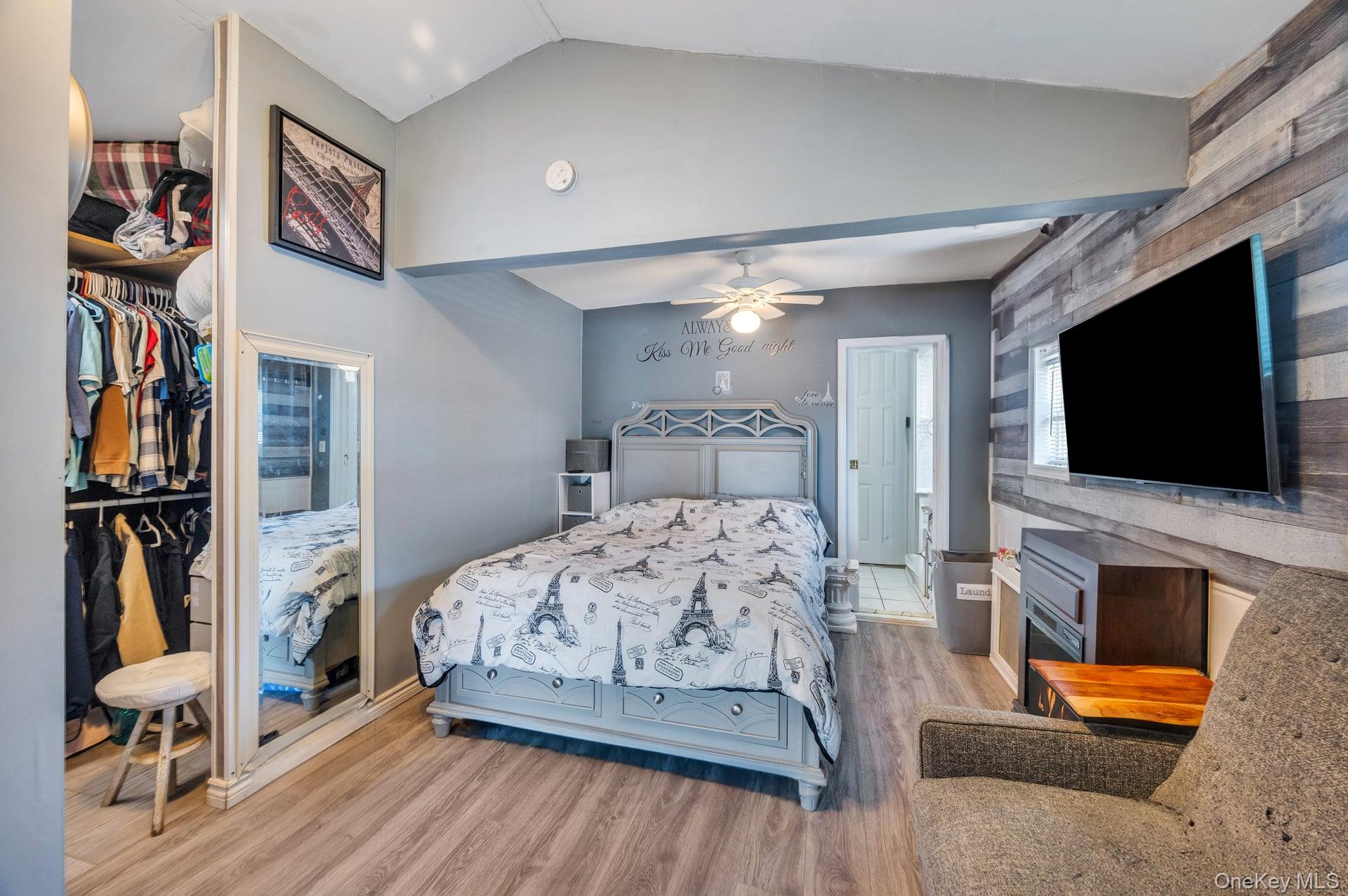 24 Raynor Street West Babylon, NY 11704 - Photo 18 of 45 Bedroom with vaulted ceiling, light wood finished floors, a closet, and ceiling fan