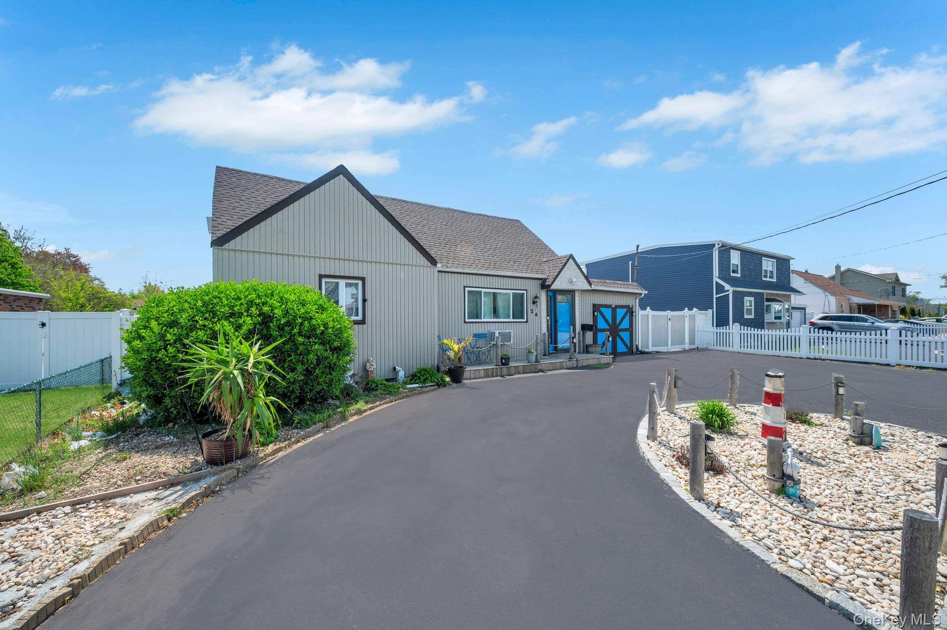 24 Raynor Street West Babylon, NY 11704 - Photo 2 of 45 View of front facade featuring a shingled roof