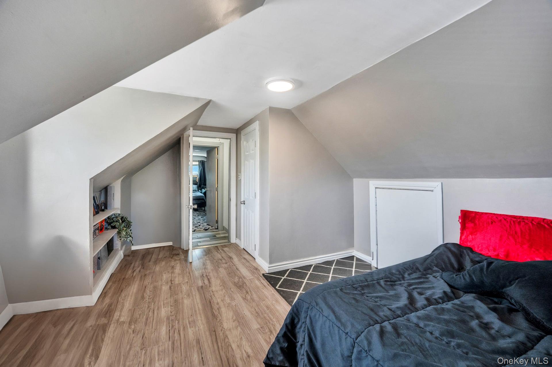 24 Raynor Street West Babylon, NY 11704 - Photo 34 of 45 Bedroom featuring wood finished floors and lofted ceiling