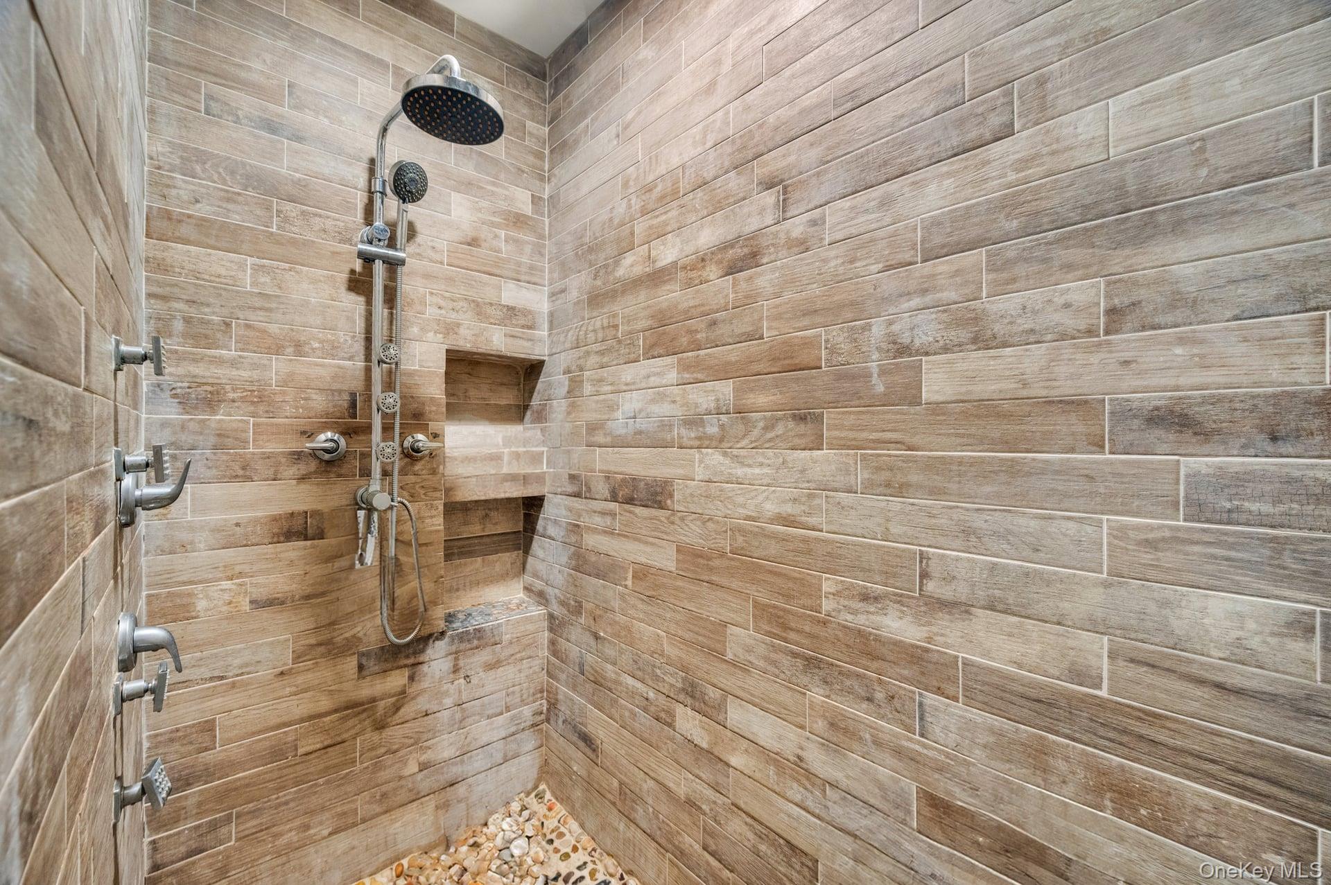 24 Raynor Street West Babylon, NY 11704 - Photo 37 of 45 Full bath featuring a tile shower