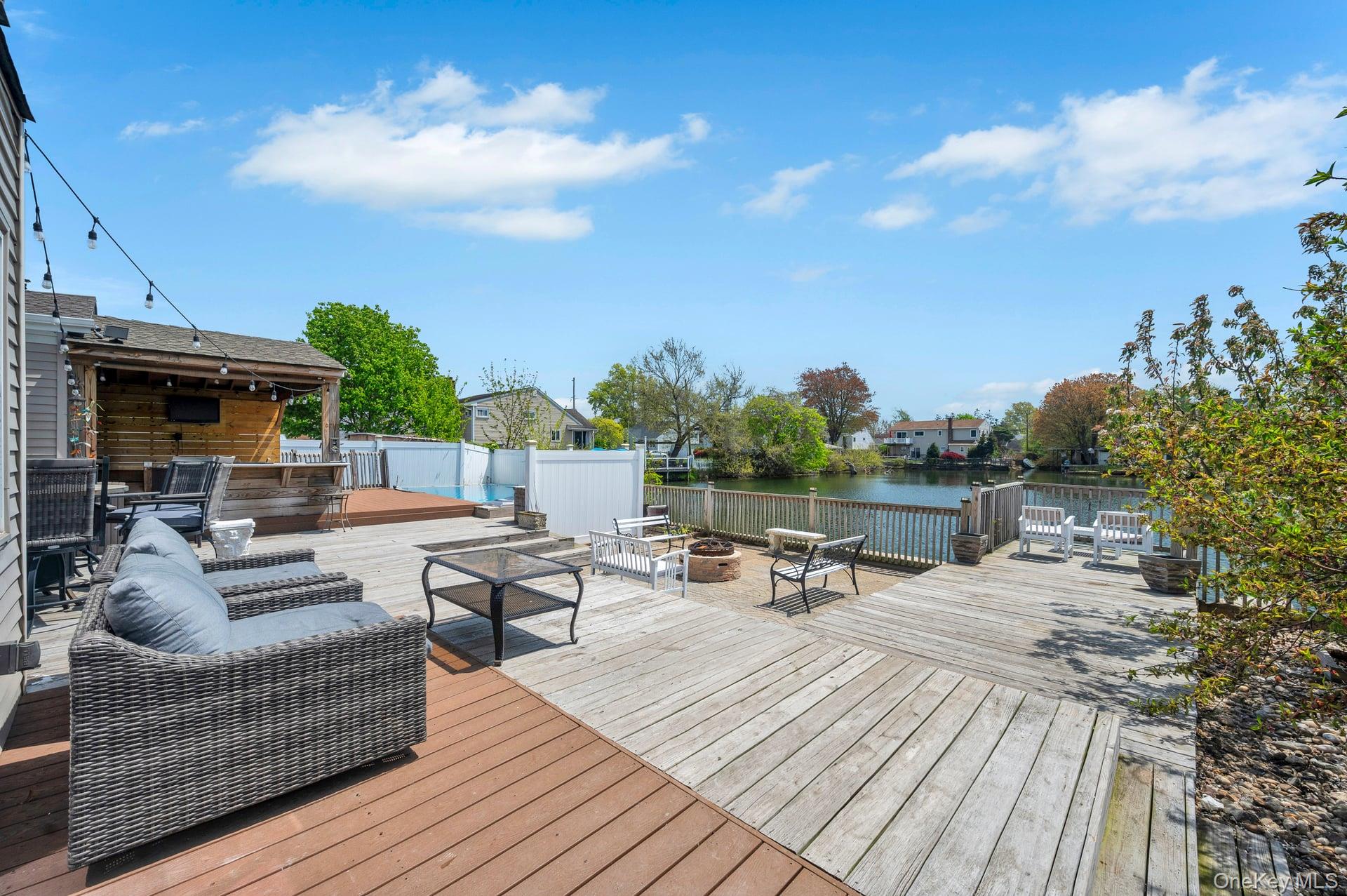 24 Raynor Street West Babylon, NY 11704 - Photo 45 of 45 Dock featuring a fire pit and a deck with water view