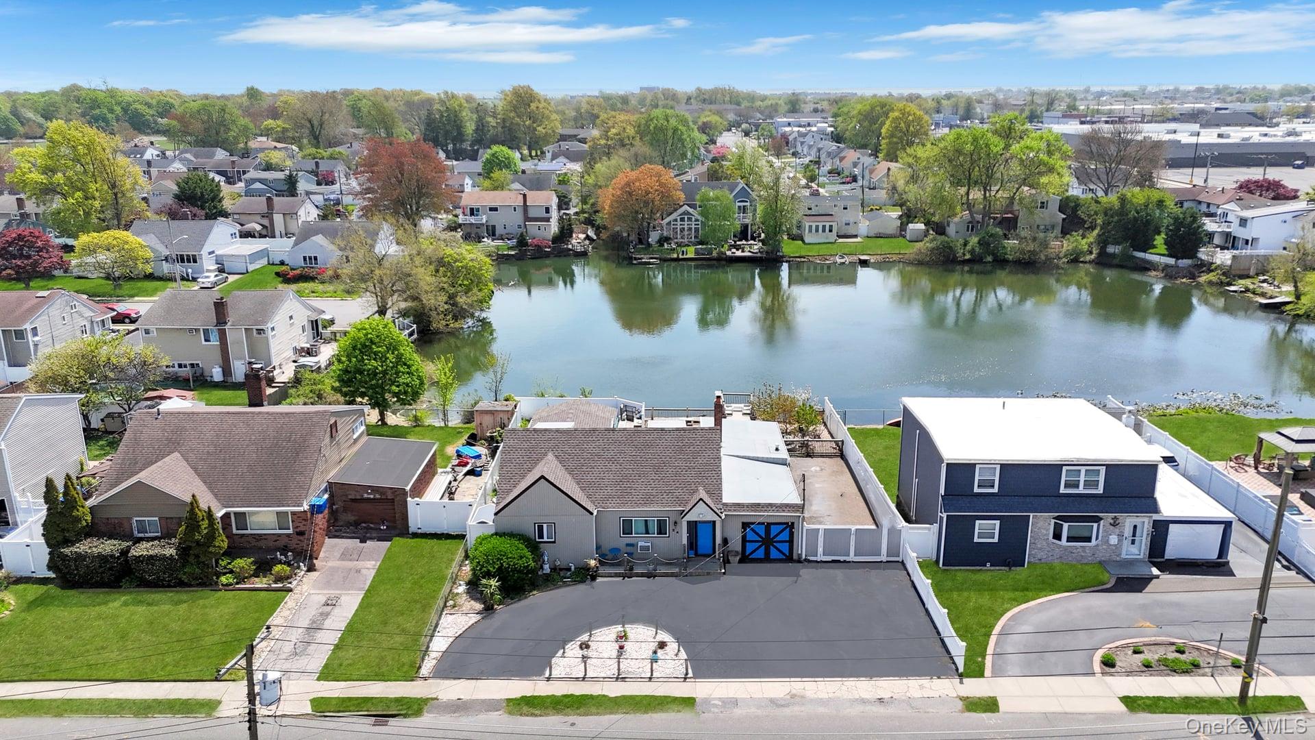 24 Raynor Street West Babylon, NY 11704 - Photo 5 of 45 Aerial view of residential area with a large body of water
