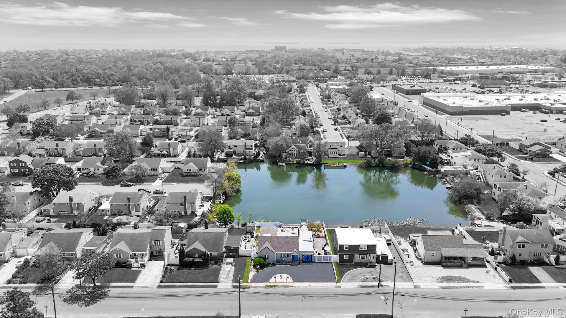 24 Raynor Street West Babylon, NY 11704 - Photo 6 of 45 Aerial view of residential area featuring a nearby body of water