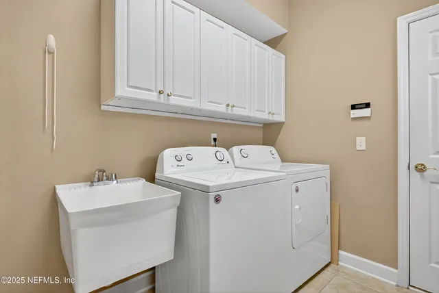 a utility room with dryer and washer