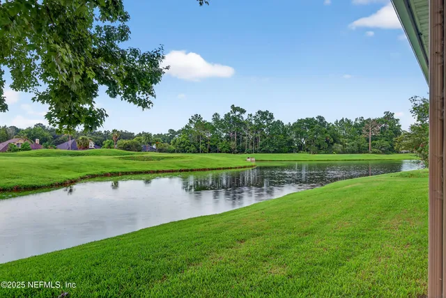 a view of a lake with a big yard