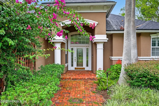 a front view of a house with yard