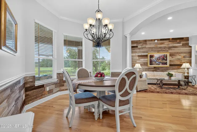 a view of a dining room with furniture window and outside view