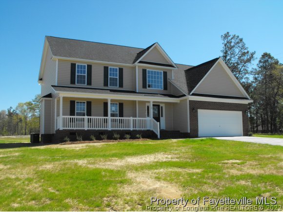 16 Trail Rider Lane Sanford, NC 27332 - Photo 1 of 3 a view of a yard in front of a house