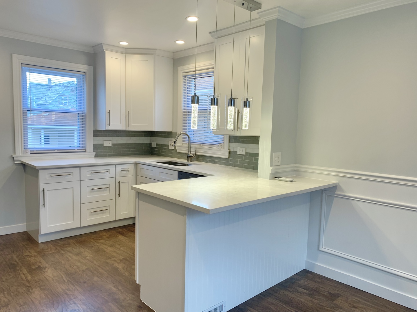 10132 South Green Street Chicago, IL 60643 - Photo 14 of 26 a kitchen with a sink cabinets and wooden floor