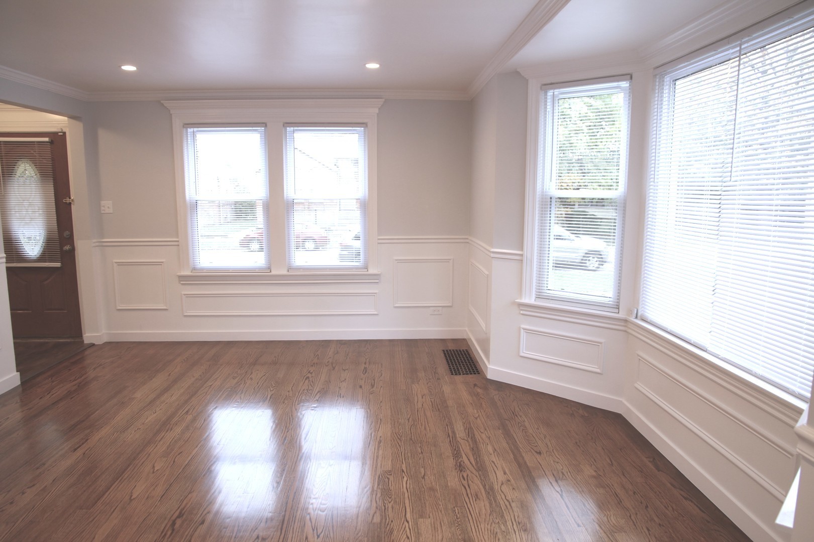 10132 South Green Street Chicago, IL 60643 - Photo 2 of 26 a view of an empty room with wooden floor and a window