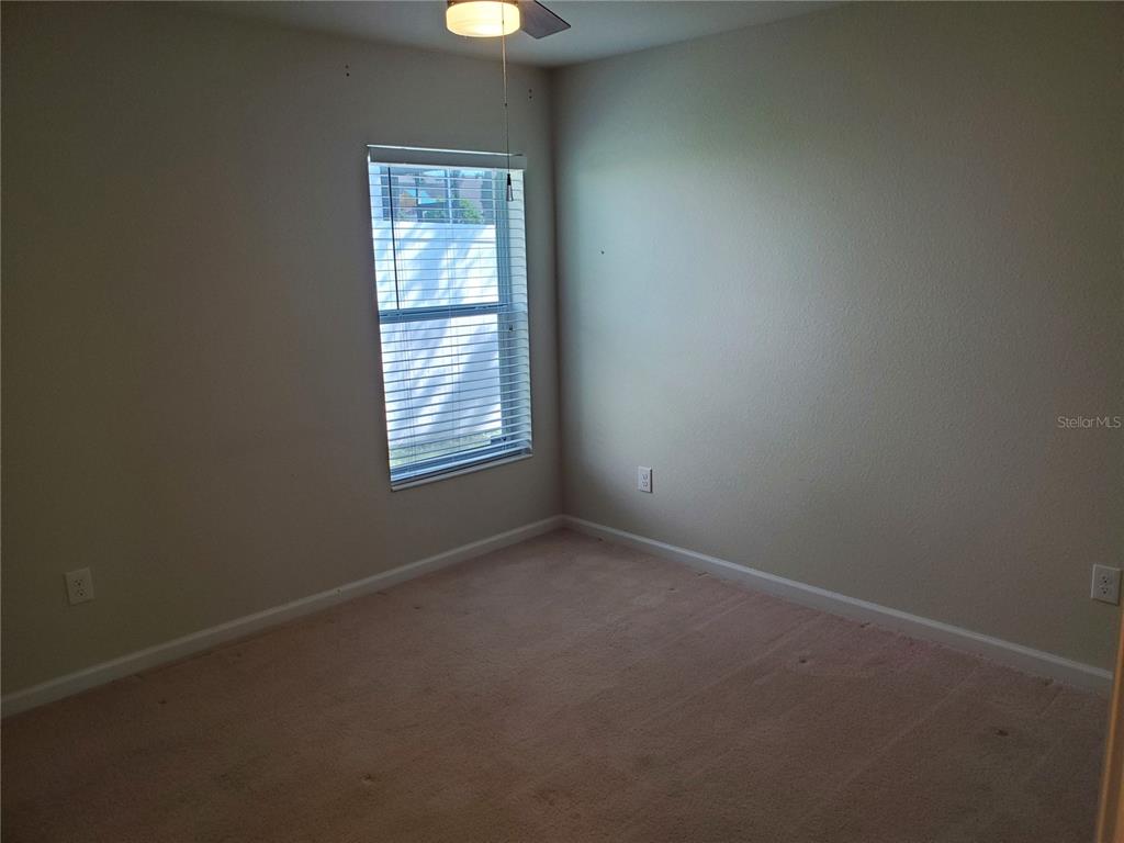 4079 Southwest 47th Court Ocala, FL 34474 - Photo 11 of 31 an empty room with a window