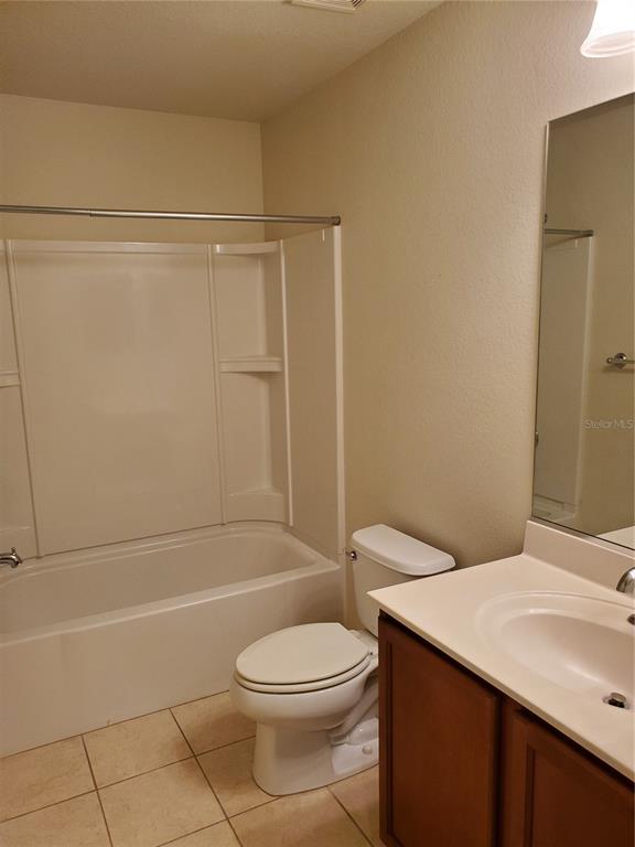 4079 Southwest 47th Court Ocala, FL 34474 - Photo 13 of 31 a bathroom with a toilet a sink and shower