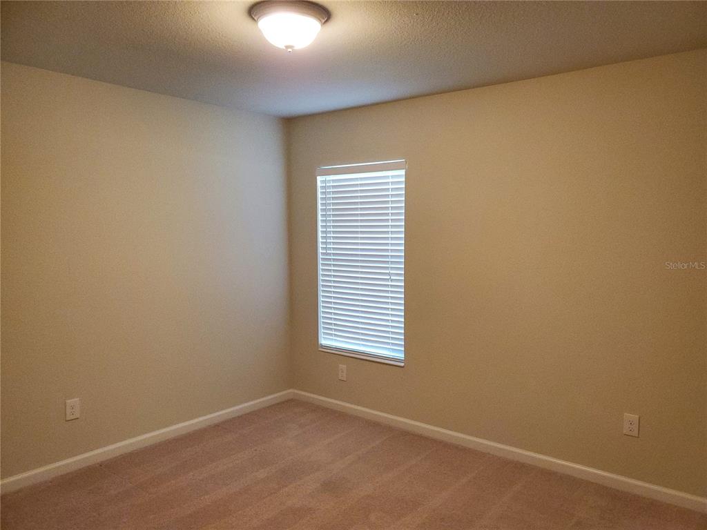 4079 Southwest 47th Court Ocala, FL 34474 - Photo 14 of 31 an empty room with a window