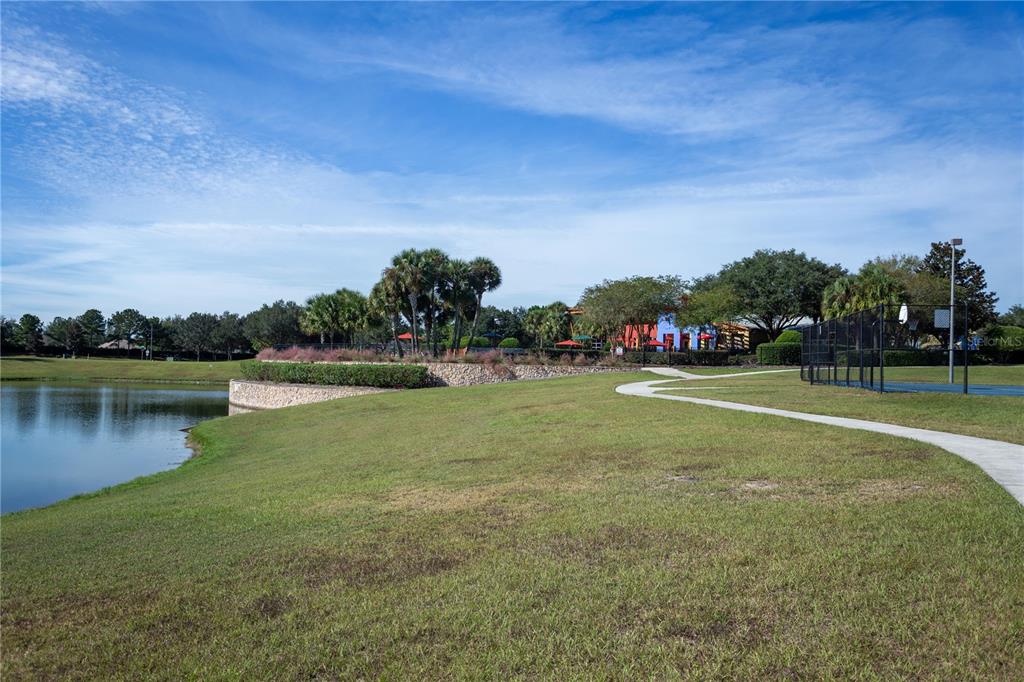 4079 Southwest 47th Court Ocala, FL 34474 - Photo 25 of 31 a view of a lake with houses in the background