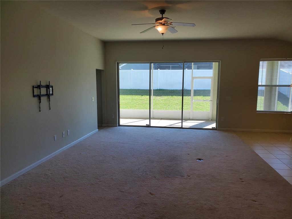4079 Southwest 47th Court Ocala, FL 34474 - Photo 4 of 31 a view of a livingroom with a ceiling fan and window