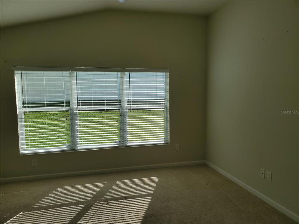4079 Southwest 47th Court Ocala, FL 34474 - Photo 5 of 31 a view of an empty room with a window