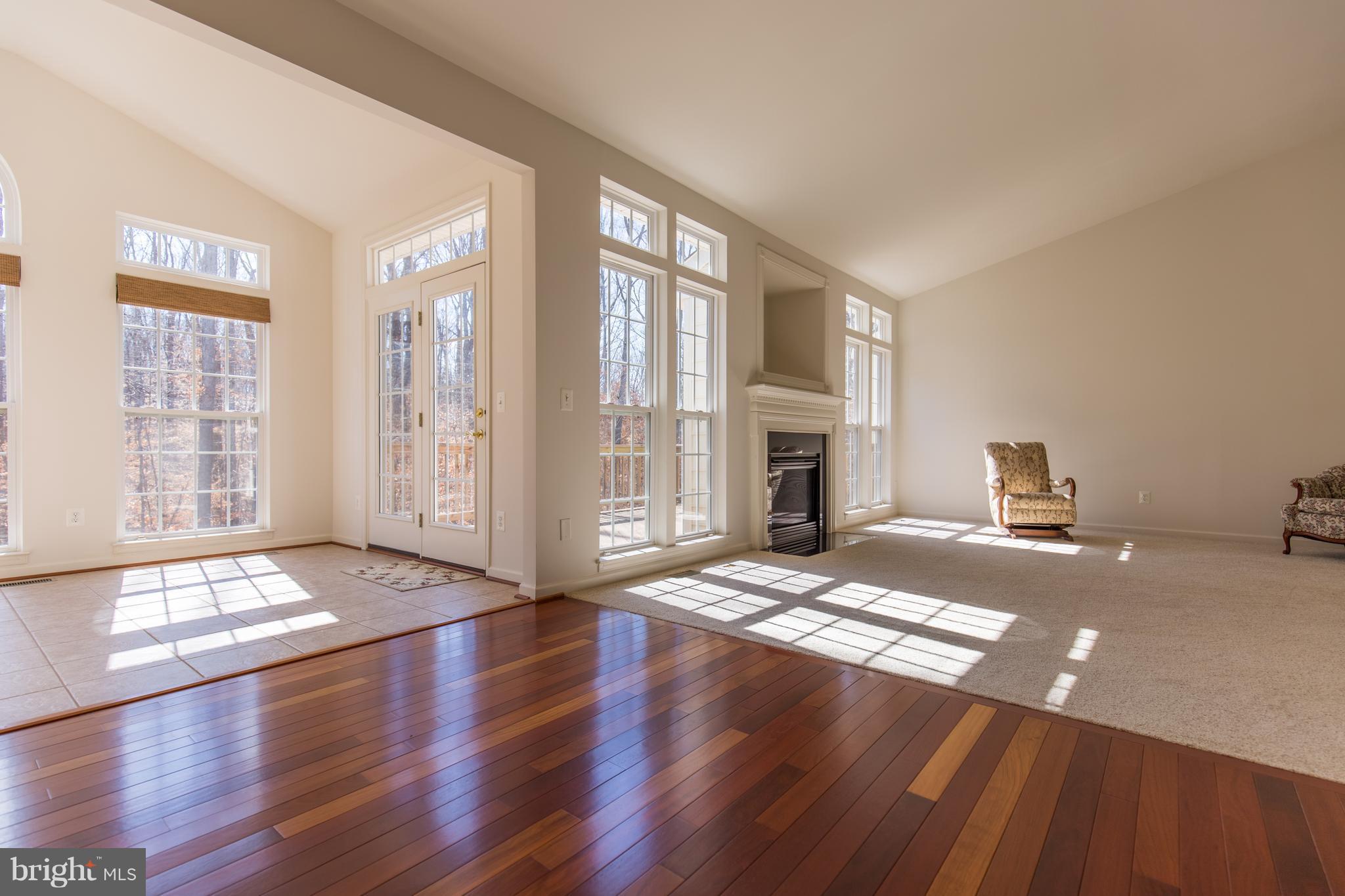697 Reedy Creek Road Louisa, VA 23093 - Photo 14 of 30 a view of an empty room with window and wooden floor