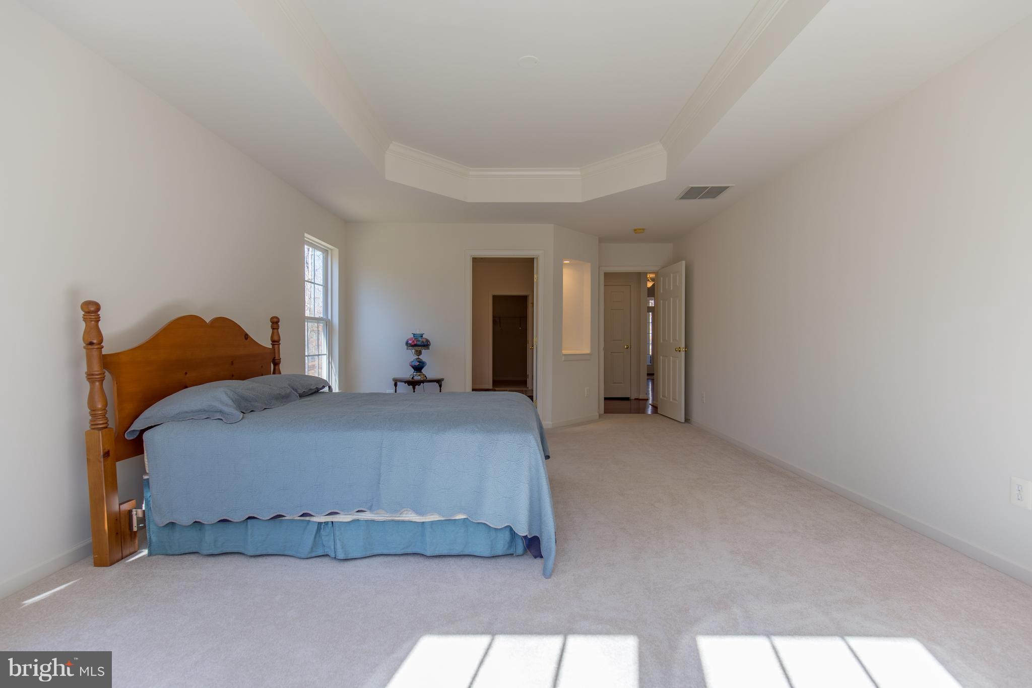 697 Reedy Creek Road Louisa, VA 23093 - Photo 22 of 30 a bedroom with bed and window
