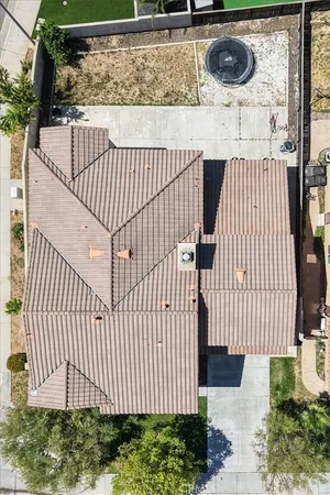 a view of a backyard with a wooden fence