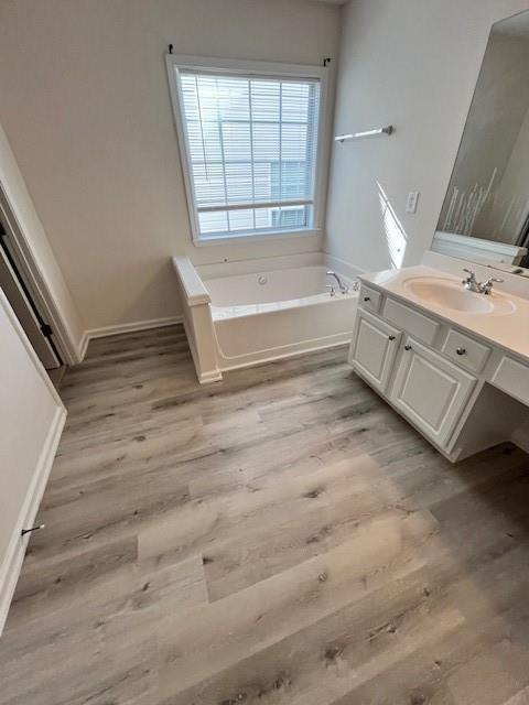 915 Wendlebury Court Alpharetta, GA 30004 - Photo 17 of 27 a bathroom with a bathtub and a sink