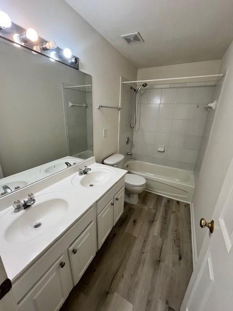 915 Wendlebury Court Alpharetta, GA 30004 - Photo 20 of 27 a bathroom with a double vanity sink and mirror with shower