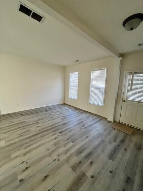 915 Wendlebury Court Alpharetta, GA 30004 - Photo 2 of 27 an empty room with wooden floor and windows