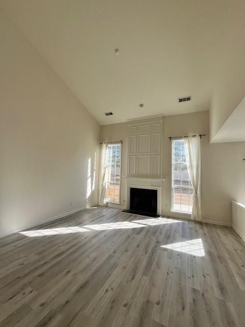 915 Wendlebury Court Alpharetta, GA 30004 - Photo 5 of 27 a view of empty room with wooden floor and fireplace