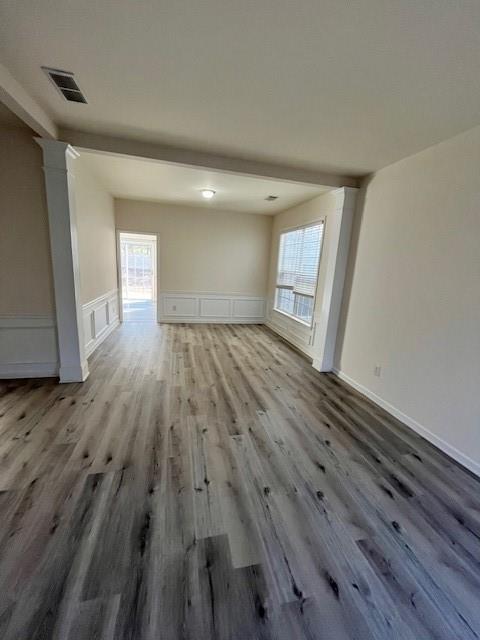 915 Wendlebury Court Alpharetta, GA 30004 - Photo 8 of 27 an empty room with wooden floor and windows