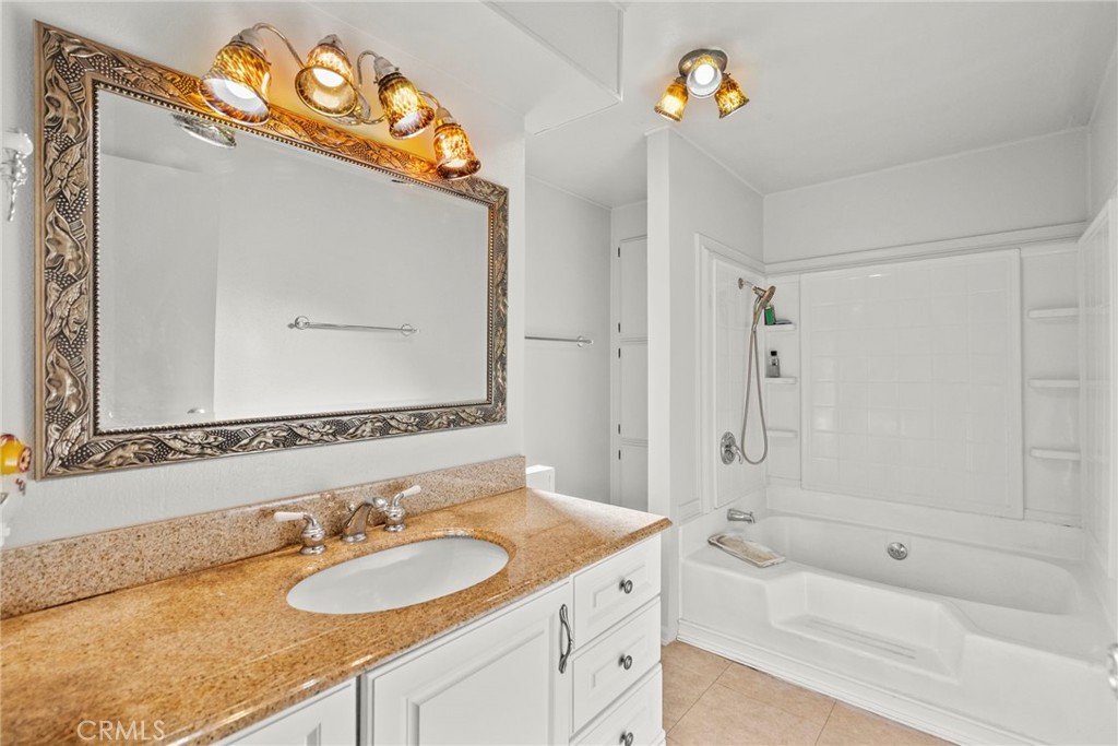 6480 Katherine, Unit 75 Simi Valley, CA 93063 - Photo 13 of 30 a bathroom with a sink mirror vanity and bathtub