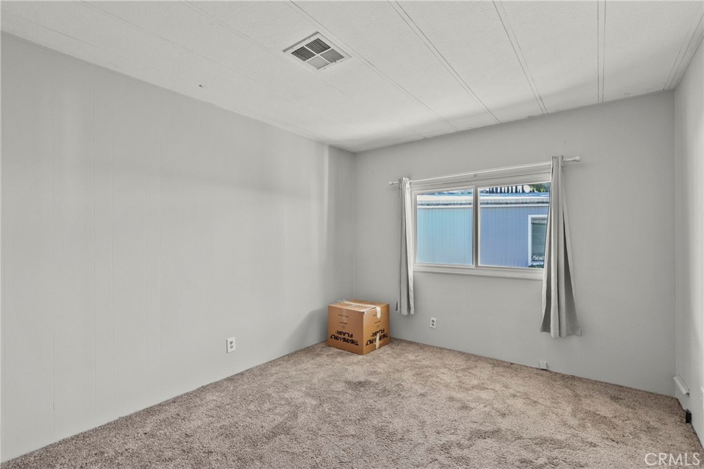 6480 Katherine, Unit 75 Simi Valley, CA 93063 - Photo 9 of 30 a view of an empty room with a window