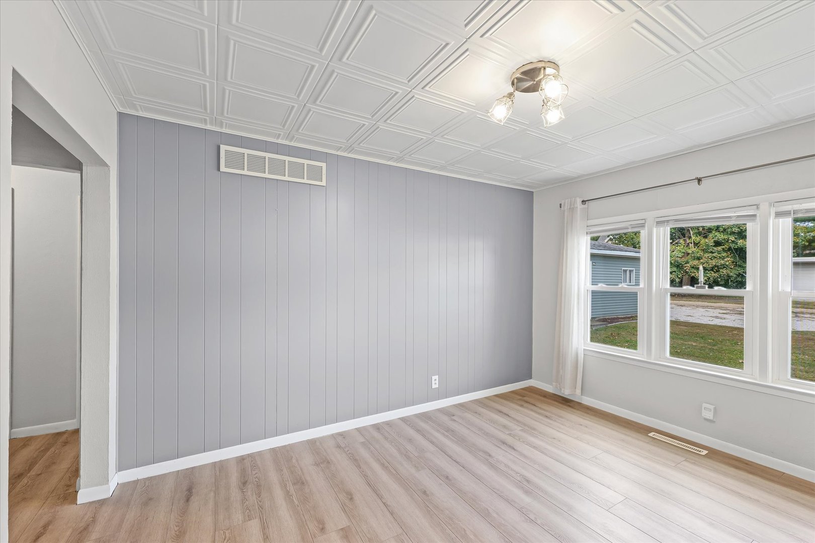 601 West Main Street Clinton, IL 61727 - Photo 11 of 33 a view of an empty room with a window