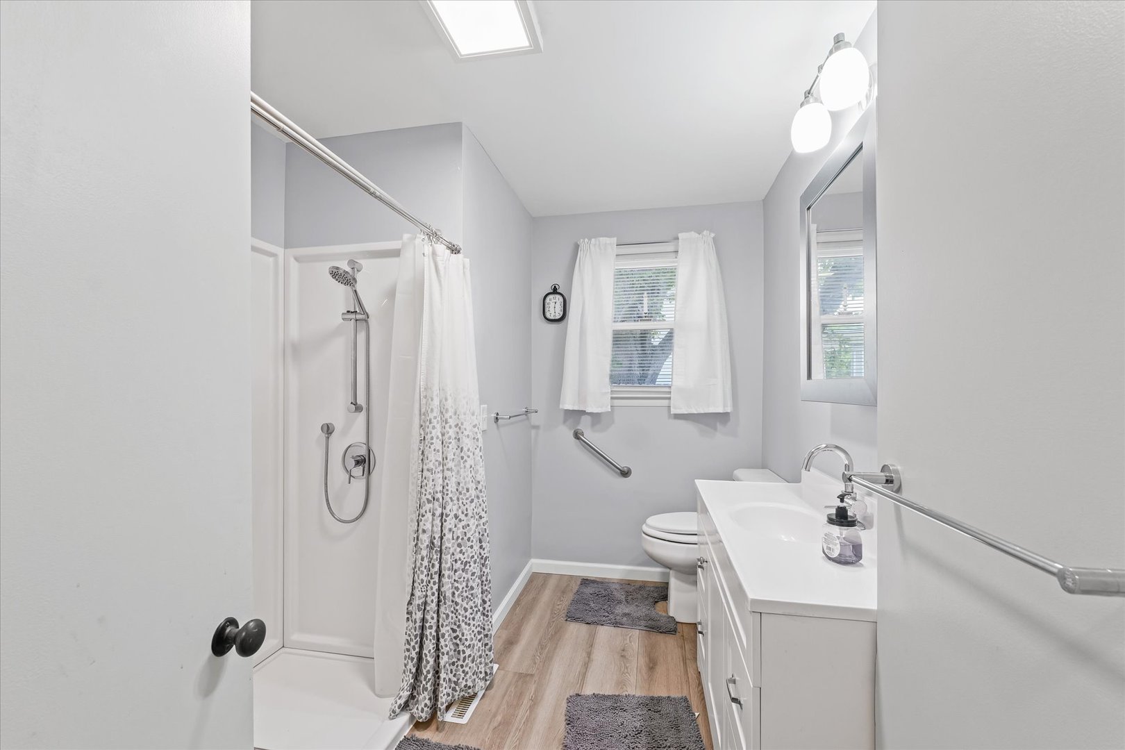 601 West Main Street Clinton, IL 61727 - Photo 22 of 33 a bathroom with a sink a toilet and shower