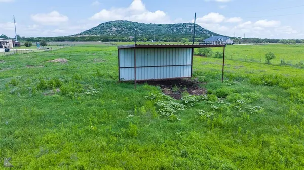 a fire hydrant in the middle of a field