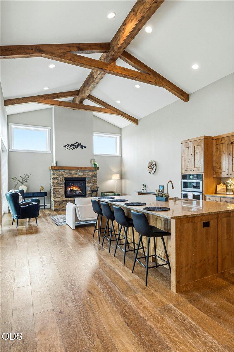 61333 Kindle Rock Loop Bend, OR 97702 - Photo 18 of 53 a living room with furniture a fireplace and a table