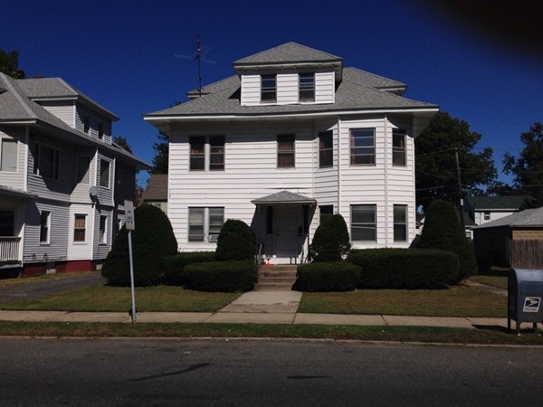 529 White Street Springfield, MA 01108 - Photo 1 of 16 a front view of a house with a yard