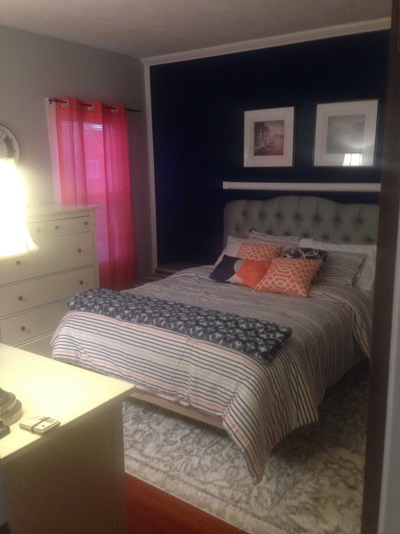 529 White Street Springfield, MA 01108 - Photo 11 of 16 a bedroom with a bed and a television