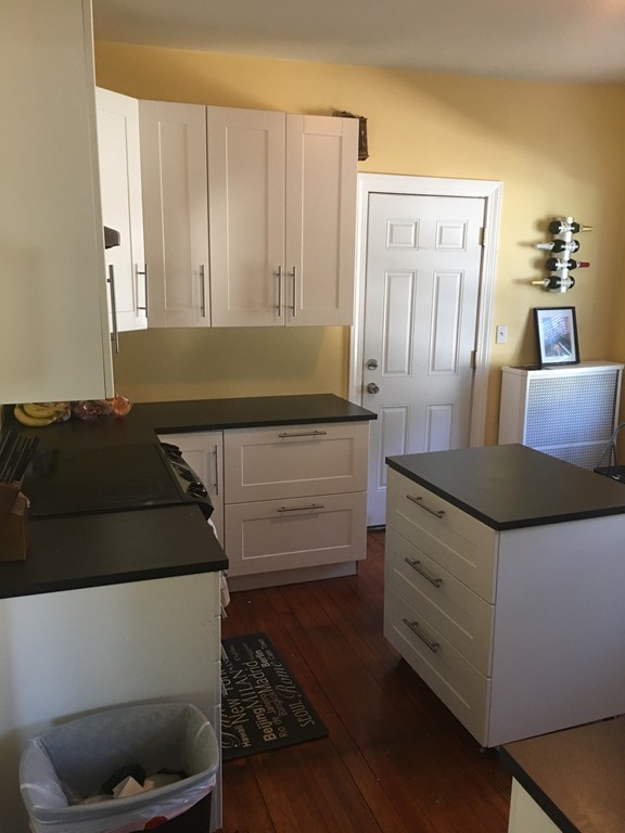 529 White Street Springfield, MA 01108 - Photo 6 of 16 a room with a couch and a dresser