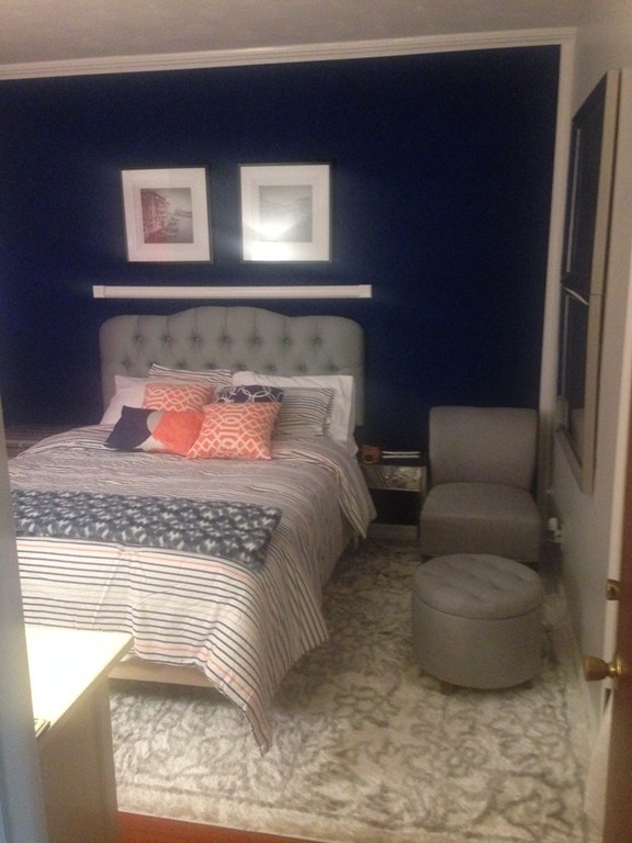 529 White Street Springfield, MA 01108 - Photo 10 of 16 a bedroom with a bed and window