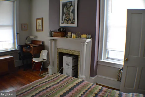 a bedroom with a bed and furniture