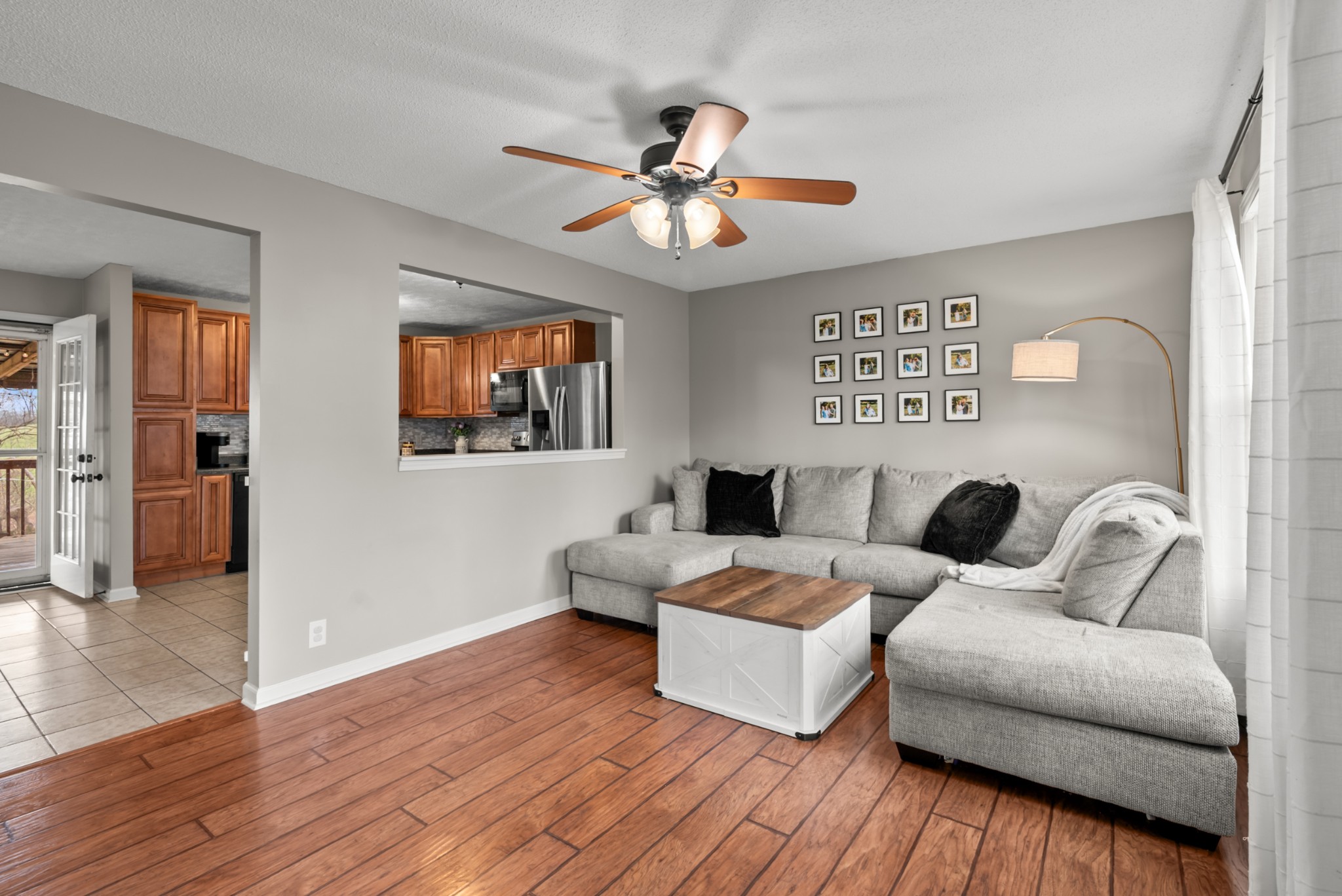 4005 Fawn Drive Springfield, TN 37172 - Photo 4 of 40 a living room with couches and painting on the wall with wooden floor