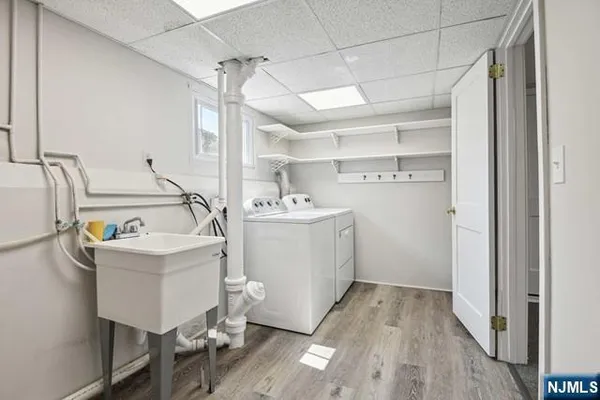 a utility room with cabinets dryer and washer