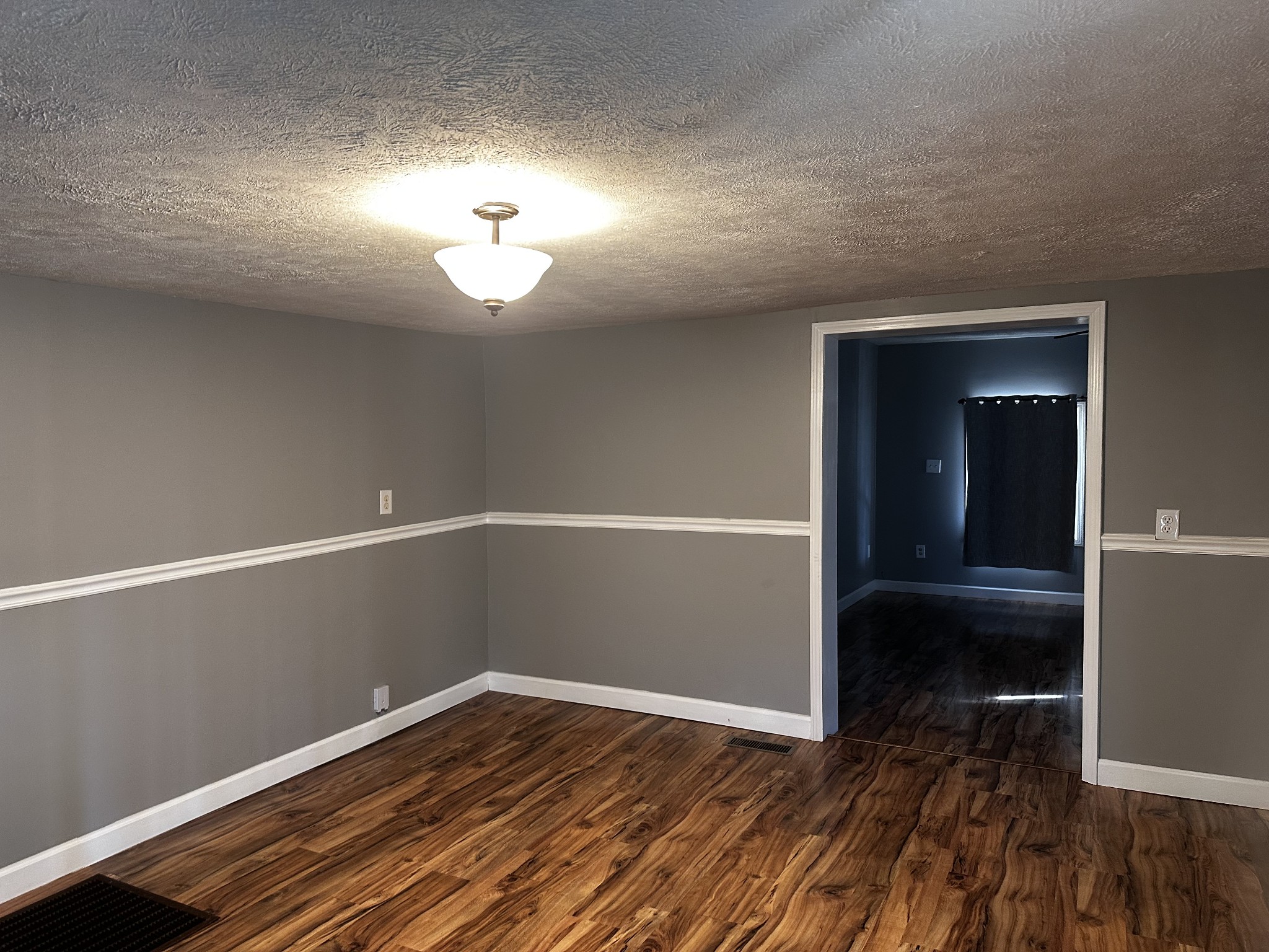 1306 Bumpus Mills Road Dover, TN 37058 - Photo 3 of 9 a view of empty room with wooden floor